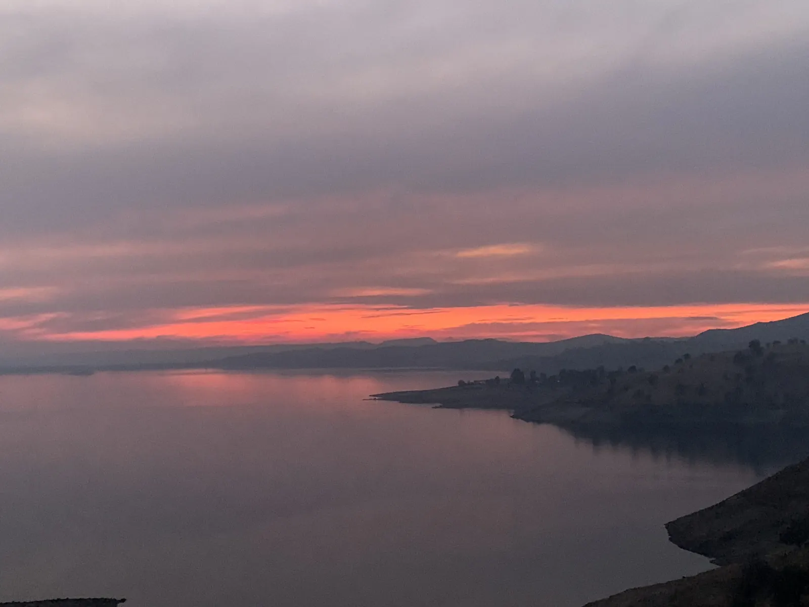 Pink sunset over Millerton Lake and the foothills